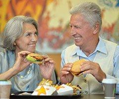 older couple eating food